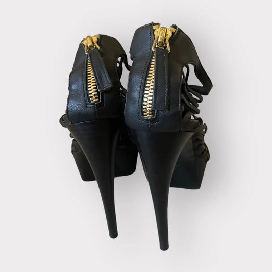 Alexander McQueen - Strappy platform black leather w/gold tone stiletto heels