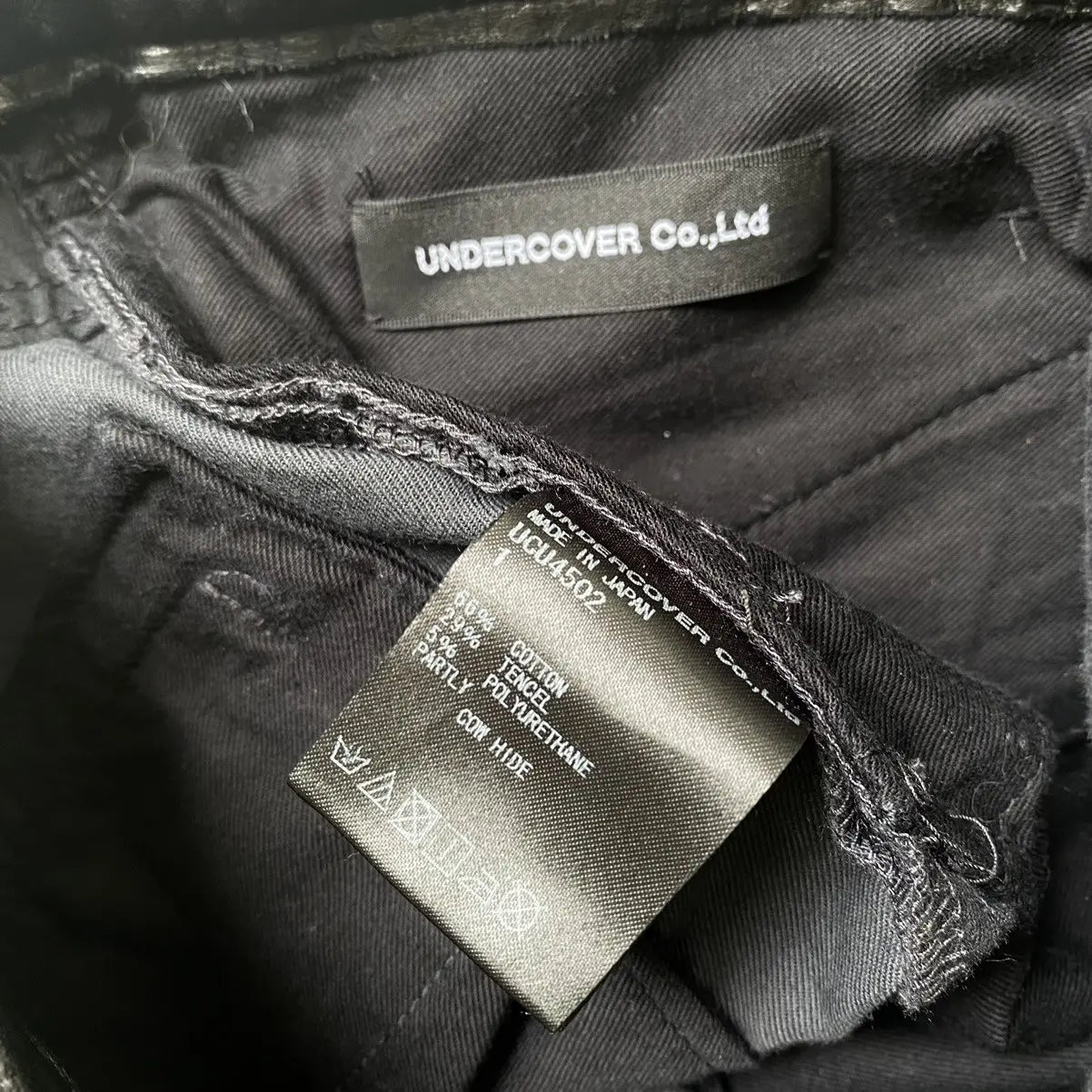 Undercover - SS18 Leather Waist Wool Vasity Patch Jeans