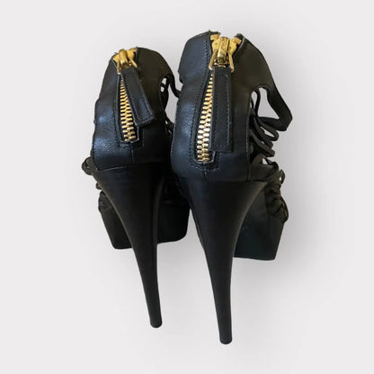 Alexander McQueen - Strappy platform black leather w/gold tone stiletto heels