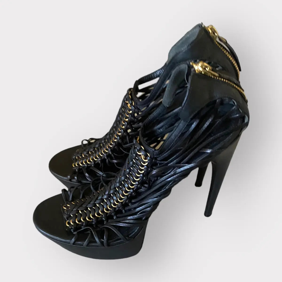 Alexander McQueen - Strappy platform black leather w/gold tone stiletto heels